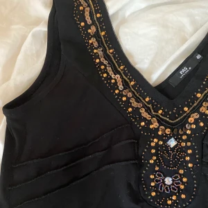 Topp i storlek 40/M - Paljettopp (strechig) i storlek 40, som M😊