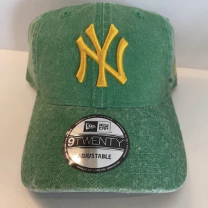 Keps - Helt ny keps från New Era. Alla tags kvar, aldrig använd. Grön - New York Yankees.  9 Twenty. Adjustable