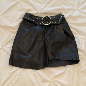 Mini skirt with belt - studded mini flip skirt. 
