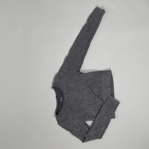 Fila topp! - En grå melerad crop top grån fila