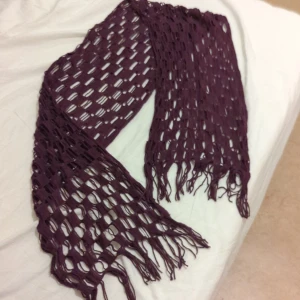 Stylish knitted scarf  - The burgundy color scarf would be the best company with you during this winter.