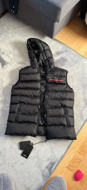 Icon2 - Har en väst märke av icon2 har inte använt den den är dun väst