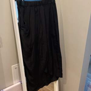 Black silk skirt from Topshop with elasticated waist and crossover front.