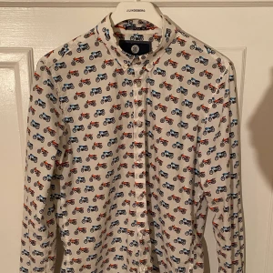 NOIZE Amstrdm shirt, Medium. - Relaxed fit white shirt with motorcycle motif. Good condition. Bought in Amsterdam.