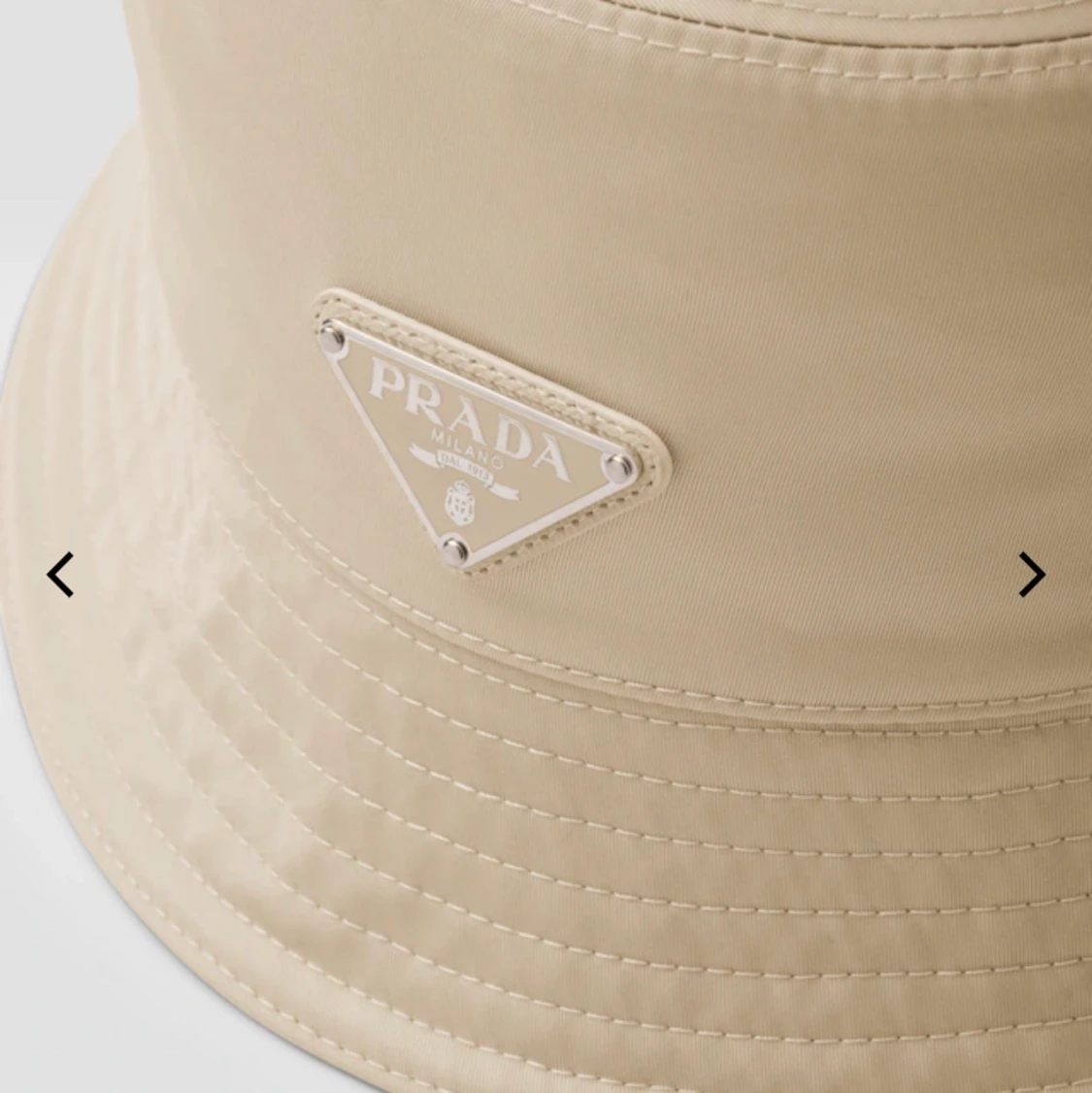 Intressekoll Beige Prada bucket hat