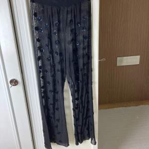 Black transparant party pants with sequins 