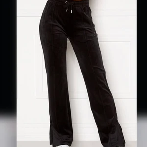 Black Juicy Pants - These black juicy pants are very trendy, in a very good shape and size S. I am also selling it for a  much cheaper price.