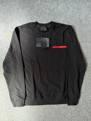 Prada black sweater - Size is M, true to size Just as new, never worn. Feel free to ask questions
