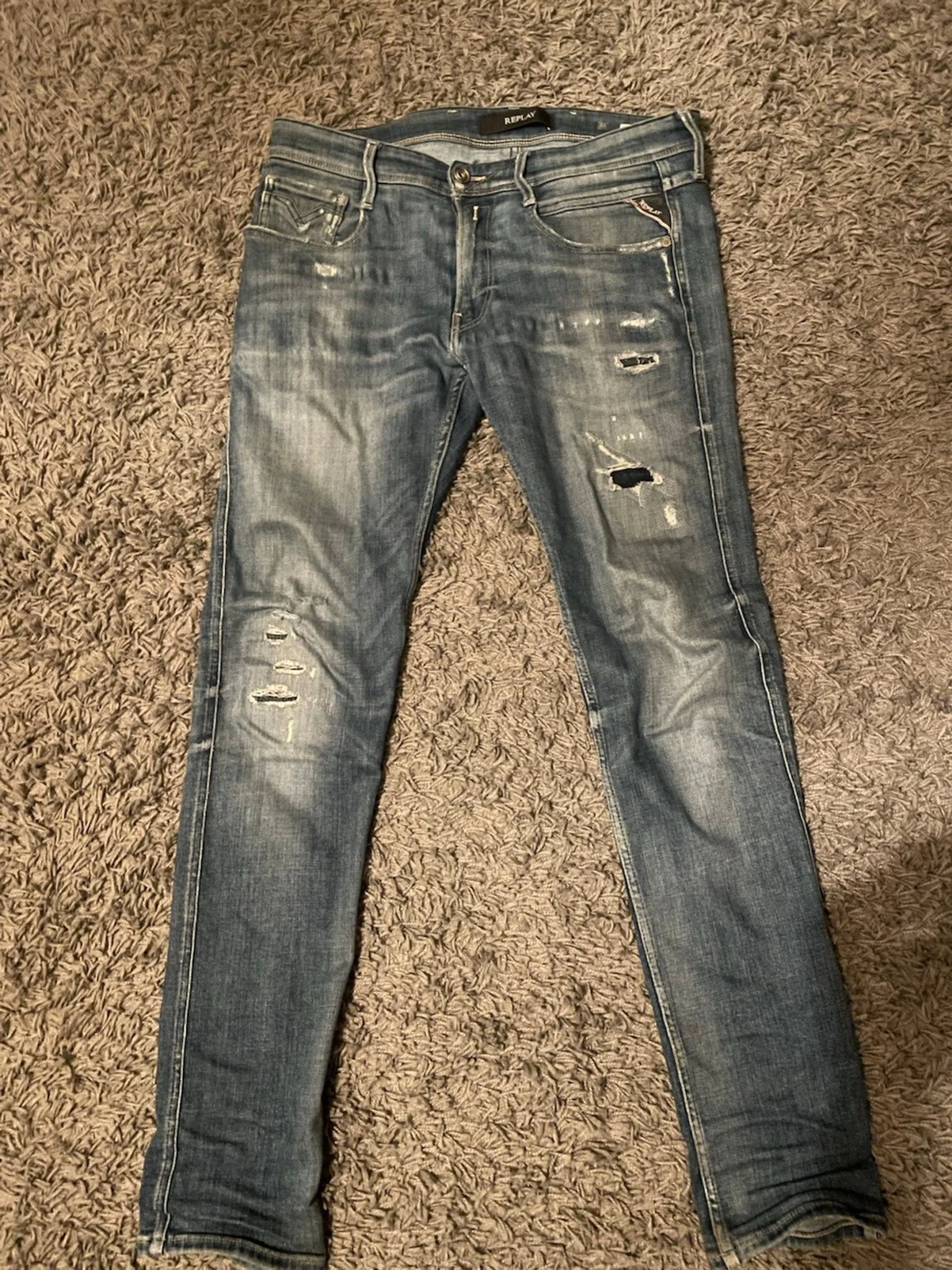 Blå slitna skinny jeans från Replay