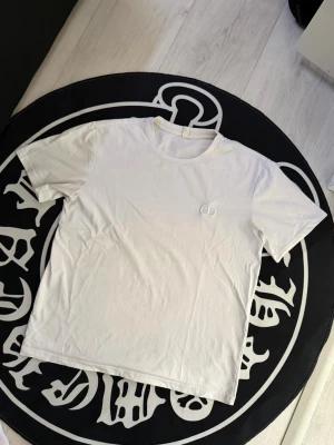 CD white T shirt - Size M, true to size. Just like new, unused. Please ask questions if needed