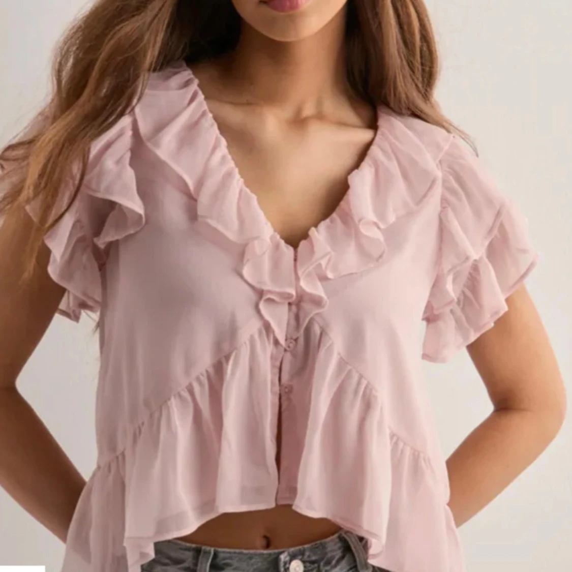 Ljusrosa volangblus från Nelly