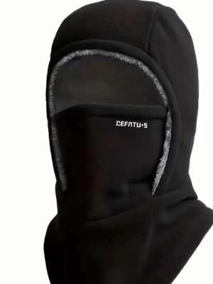 Svart balaclava från Cefatu-S - Svart balaclava med grå kantdetaljer från Cefatu-S. Huvudbonaden täcker hela ansiktet förutom ögonen och är tillverkad i ett mjukt, stretchigt material. Perfekt för kalla dagar eller utomhusaktiviteter.