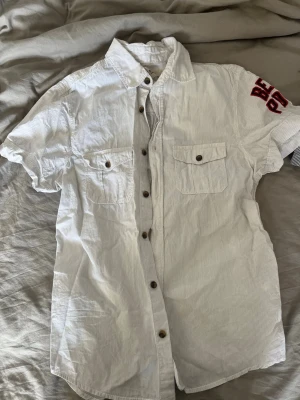 Skjorta för barn  - Skjorta i storlek 164, knappt använd. 