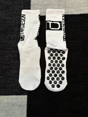 Grip Socks Tapedesign 🧦 - Brand new white grip socks by Tapedesign, perfect for sports and everyday use.  ⭐️ Condition: 10/10 🎨 Color: White 📦 Fast and careful shipping