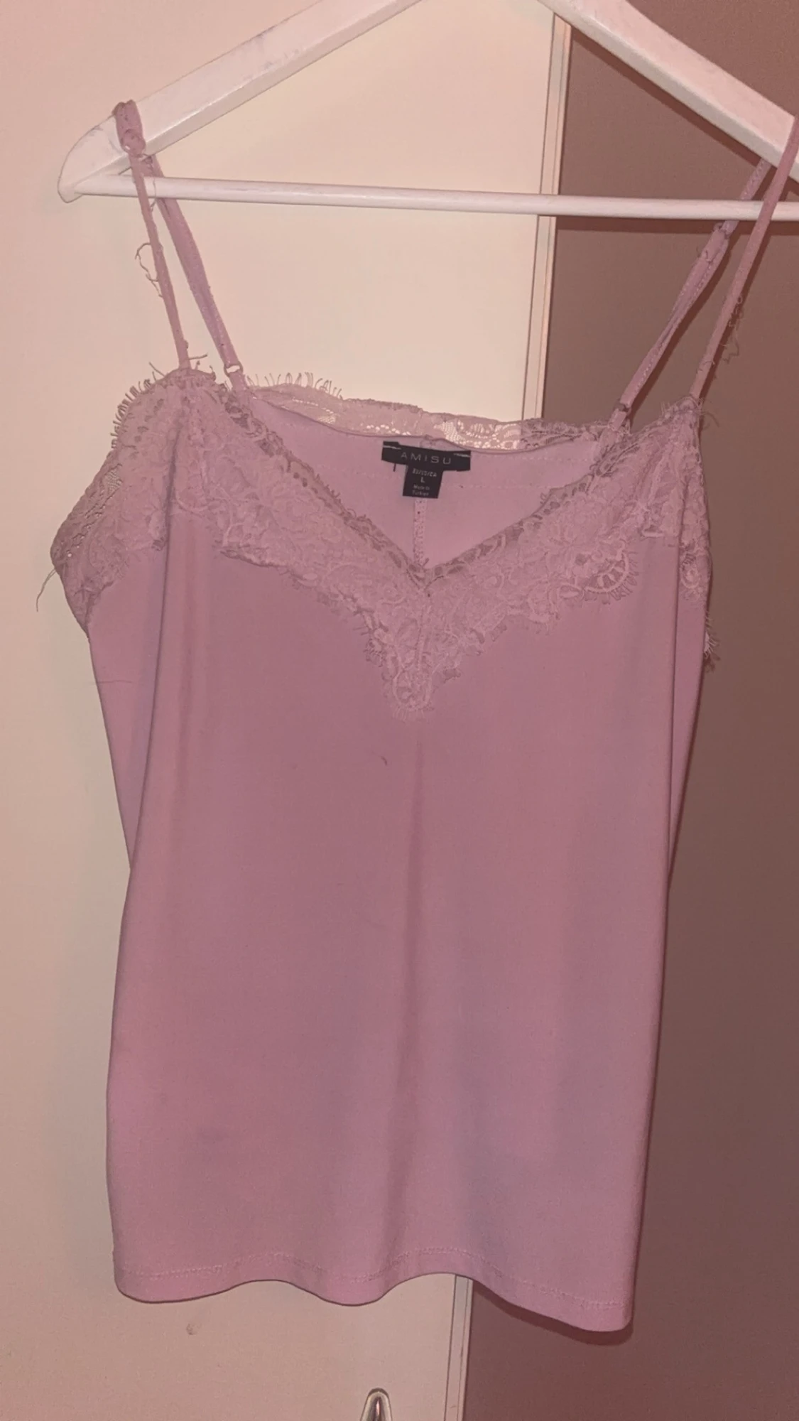 Ljusrosa linnetopp med spets