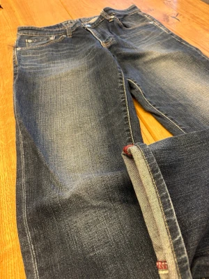 Edwin Blue Trip Edgeline 503 Regular Jeans (W33) 🇯🇵 - Edwin Blue Trip Edgeline 503 Regular Jeans (W33) 🇯🇵 Dark blue-grey fade with subtle contrast & natural two-tone effect • Slubby denim adds depth & texture • Red arcuate stitching & bold leather patch • Red zip fly & pocket lining • 503 Regular straight fit • Honest wear with great character Rare Blue Trip piece with strong early-2000s appeal  Feel free to ask for more details! (11)