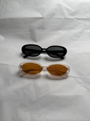 Solglasögon 2 st - Helt nya aldrig använts. Båda meddöljer