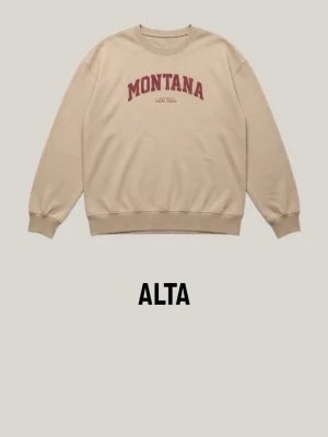 Beige sweatshirt med MONTANA-tryck - Beige sweatshirt med rött MONTANA-tryck på bröstet och rund halsringning. Orginalpris:300kr