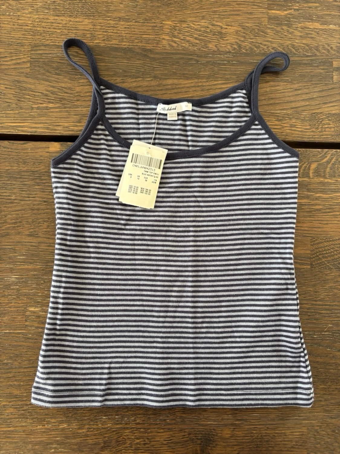 Subdued NY Randig blå och vit linnetopp