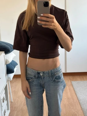 Brun t-shirt med knytning - Supersnygg brun topp man knyter baktill, från Lager157, inga defekter. I storleken XS❤️