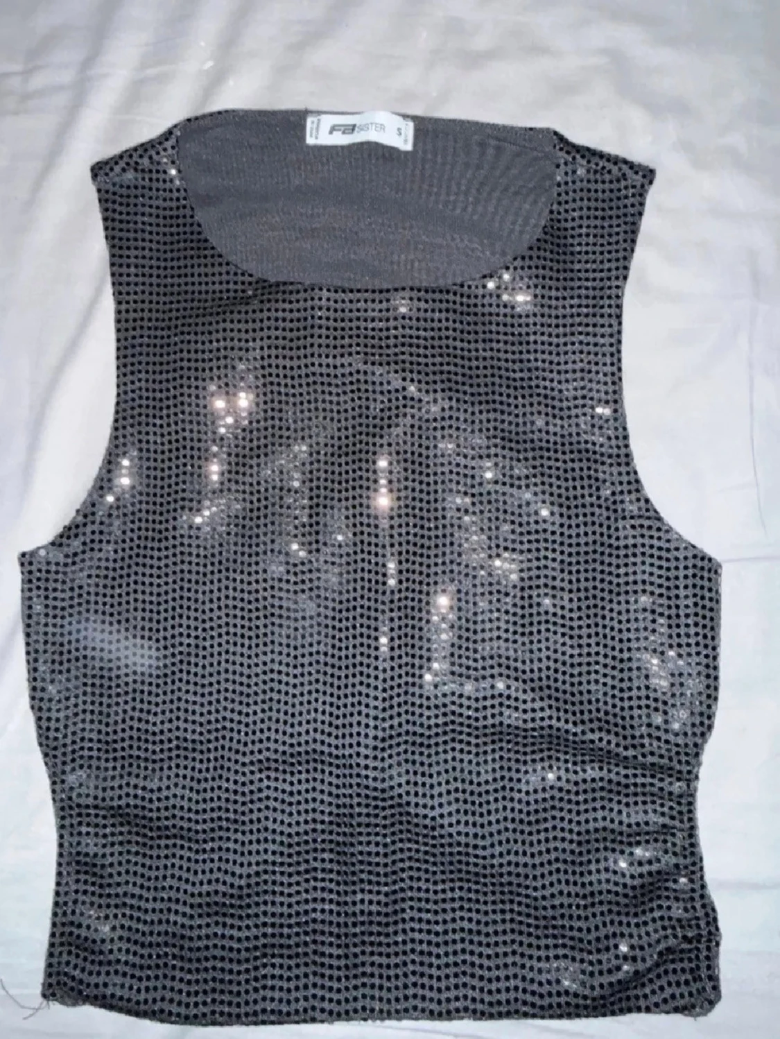 Glittrig svart linnetopp från FB sister