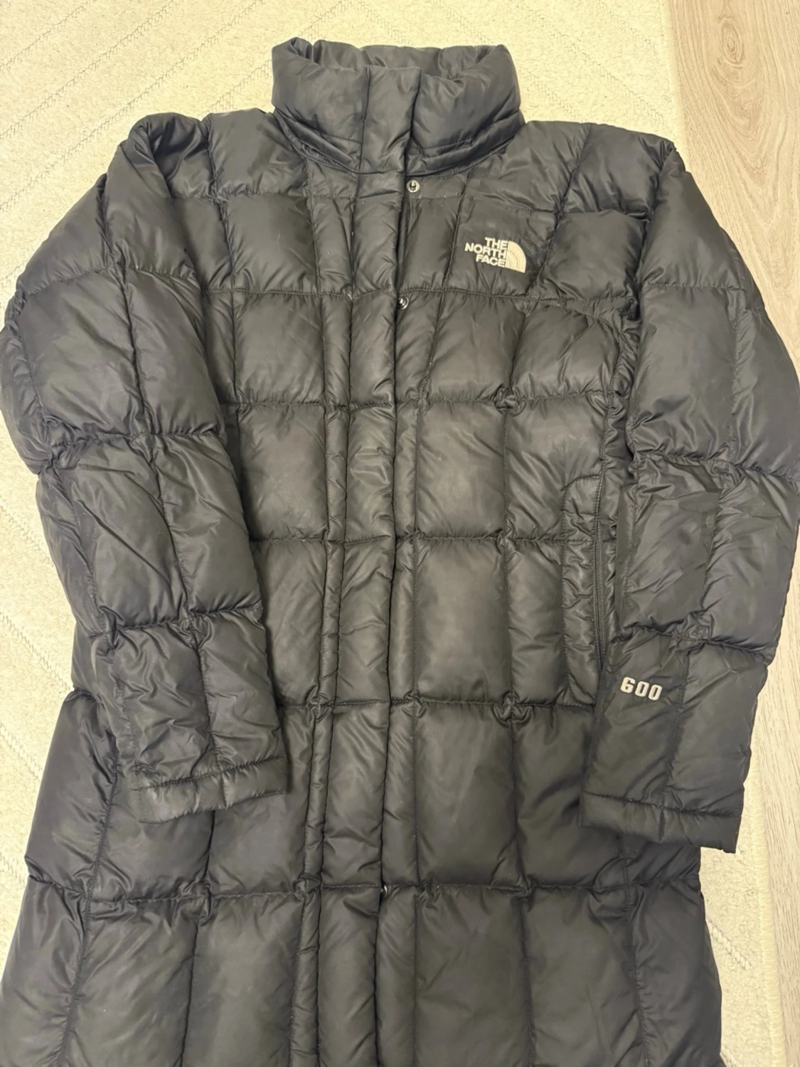 Svart lång dunjacka från The North Face