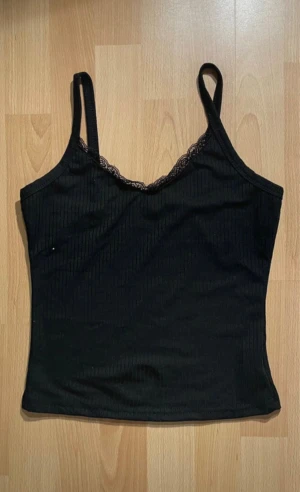 Black fitted top with straps - Chiquease Lace Insert Slim Fit Cami Top.