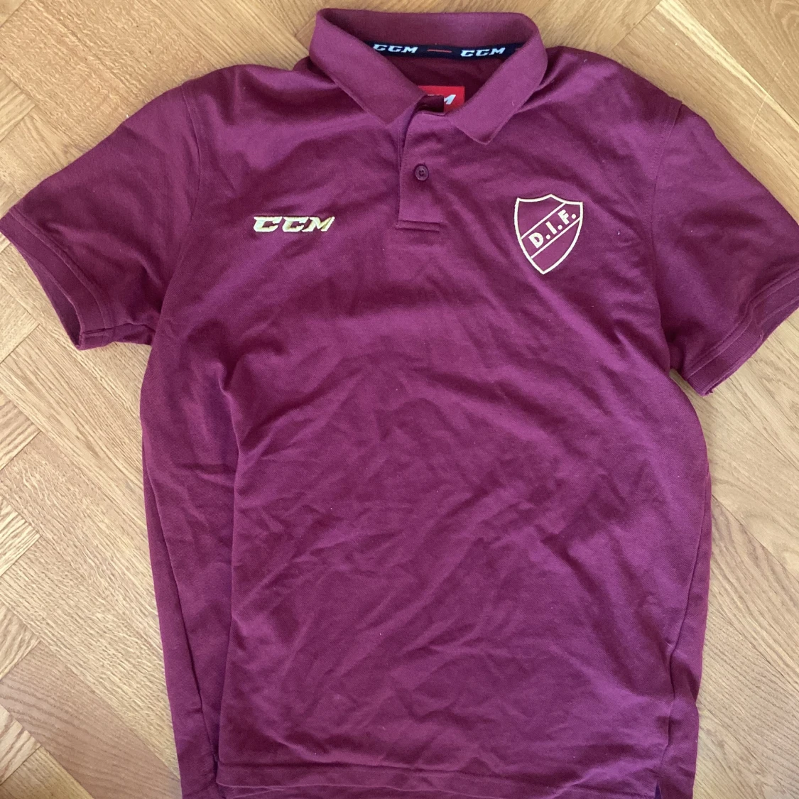 Vinröd CCM DIF pikétröja stl L