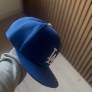  LA Dodgers Cap - Väldigt bra skick, använd ett fåtal gånger. Priset kan diskuteras. 
