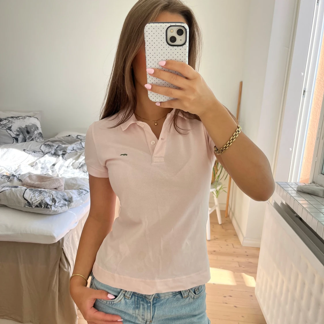 Ljusrosa piké från Lacoste