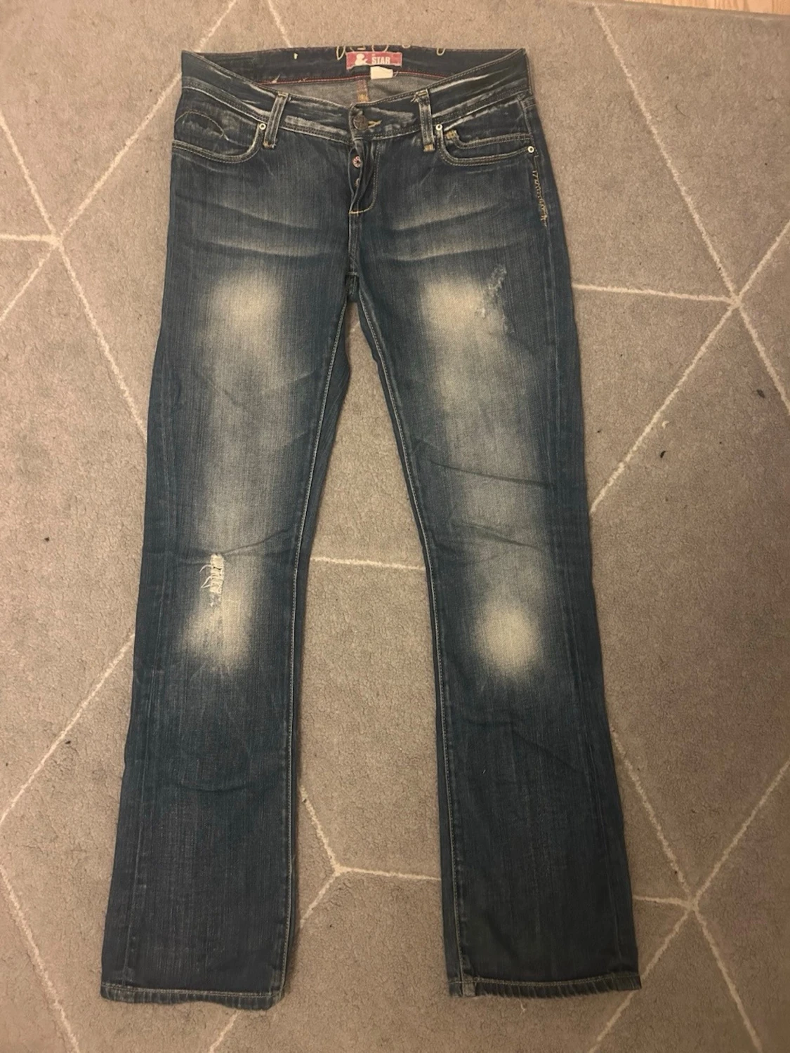 Blå jeans från X-Star med slitningar