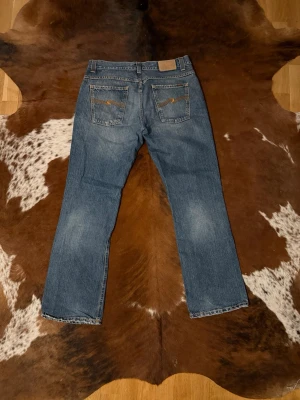 Nudie BootCutOla  - Tjena! Säljer dessa vintage nudie jeans, modellen är BootcutOla och tillverkas inte längre, W34/L32, hör av dig vid funderingar!🙌