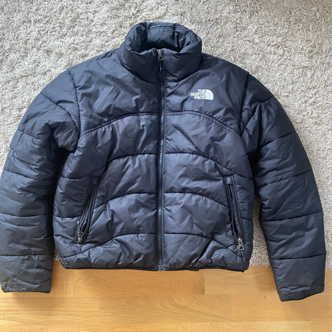 Svart pufferjacka från The North Face