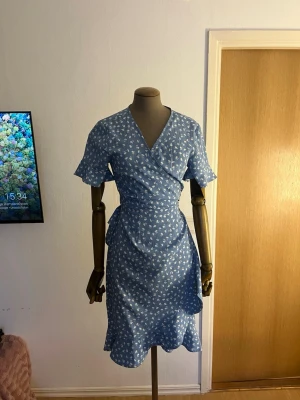 Blue and white flower dress - Cute dress for summer and special occasions. Short sleeves and you can tie it how tight you want. I have used it a few times 