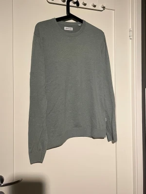 Grön stickad tröja från Jack & Jones - Snygg grön stickad tröja från Jack & Jones. Xs/s