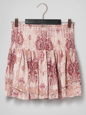 Beige och röd mönstrad kjol Lindex - Supersöt kortkjol från Lindex i rosa med paisleymönster. Kjolen har smock i midjan och volangig nederdel 