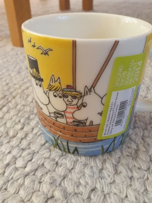 Muminmugg Segla med Klippdassar Mumin  - Utgången felfri mugg med etikett kvar. Packar mycket bra. 