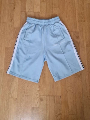 Palm angels shorts - Selling a pair of authentic Palm Angels light blue shorts in size M. They are new without tags and have never been worn. Made from high-quality materials with the signature Palm Angels design, they’re perfect for everyday wear or a stylish streetwear look. From a smoke-free home. Feel free to message me if you have any questions or would like more photos. Fast shipping.