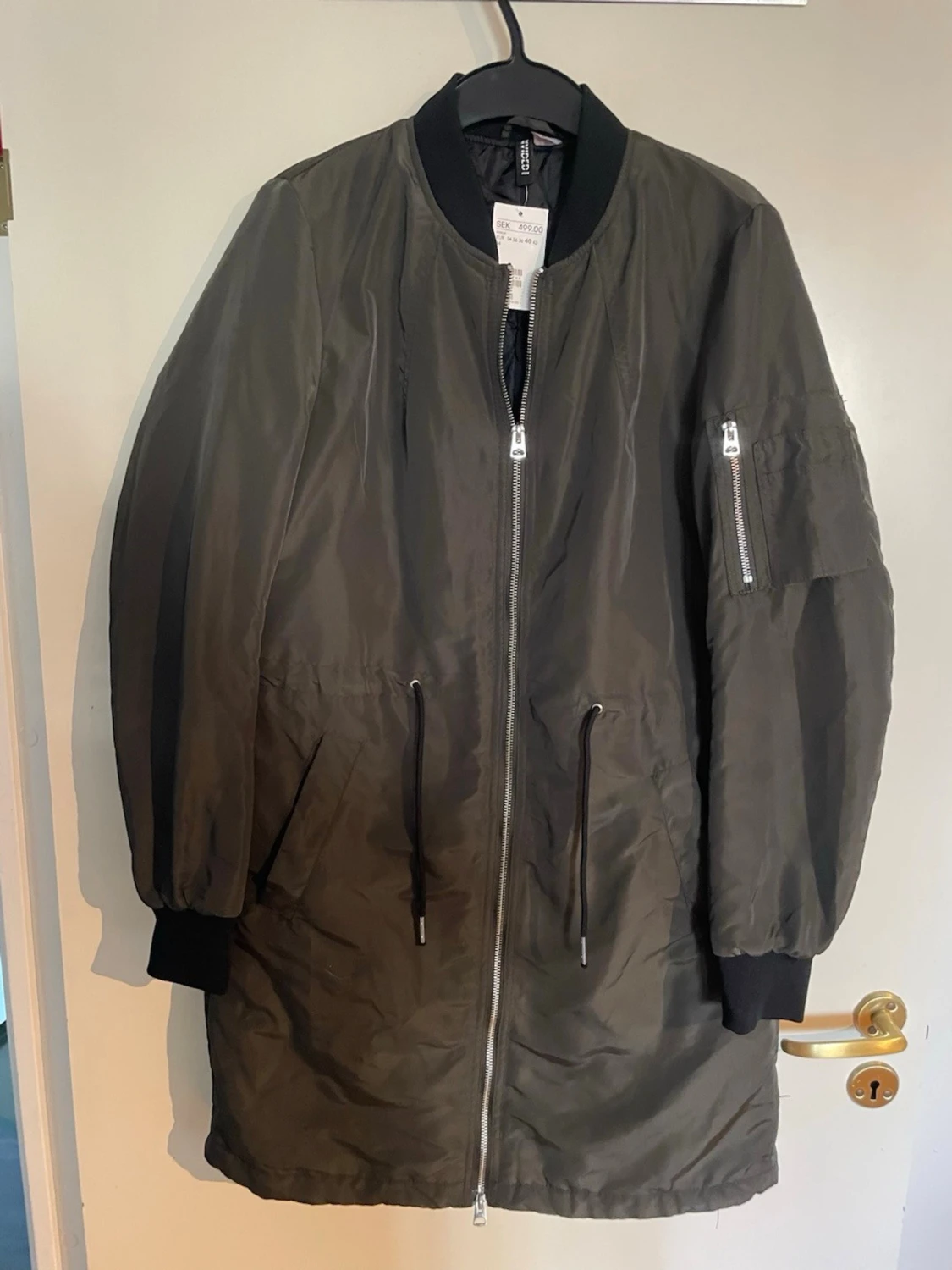 Lång grön vindjacka från H&M