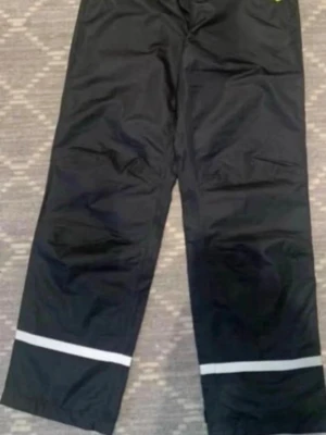Regn byxor för barn  - Regn byxor för barn storlek 146/152, använd en gång.