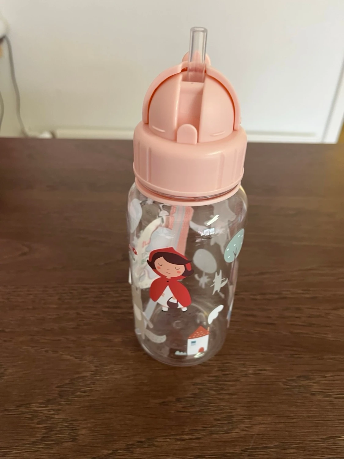 Rosa vattenflaska med sagomotiv