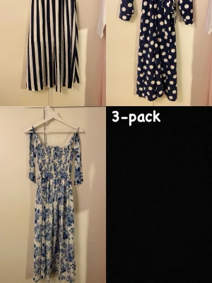 3-pack blåvita klänningar - Säljer ett 3-pack klänningar i blåvitt tema: en långrandig klänning med marinblå och vita ränder, en långärmad marinblå klänning med stora vita prickar och bälte i midjan samt en långklänning med blått blommönster på vit botten. Passar xs/s/m