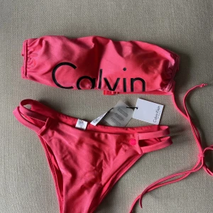 Calvin Klein bikini brand new size 36/S  - Brand new with tag on.  Diva Pink  Strapless top + high waist bottom with logo on both part  Additional straps included separately 