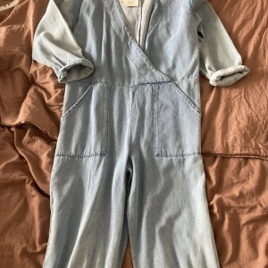 Brand new cute lose fitting denim jumpsuit.  - Pull & Bear- Cute/ brand new never worn lightblue denim jumpsuit.   