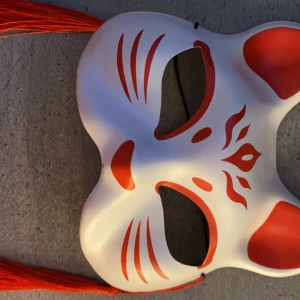 Half face Kitsune Mask - Half face Kitsune Mask . a whisker away themed ! In great condition literally nothing wrong with it , can discuss price