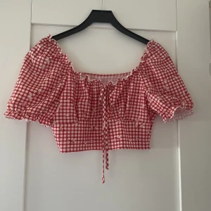 Rutig topp - Aldrig använd, dragkedja vid sidan.