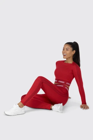 RÖD TRÄNINGSTOPP - Säljer tröjan på bilden i storlek XS. Helt oanvänd med lapparna kvar.