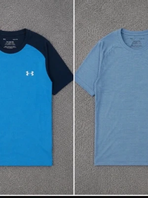 Två sportiga t-shirts från Under Armour - Säljer två snygga tränings-t-shirts från Under Armour. Ena är blå med mörkblå ärmar och logga på bröstet, den andra är ljusblå med diskret logga. Båda har rund hals och är tillverkade i ett lätt, snabbtorkande material som passar perfekt till träning.