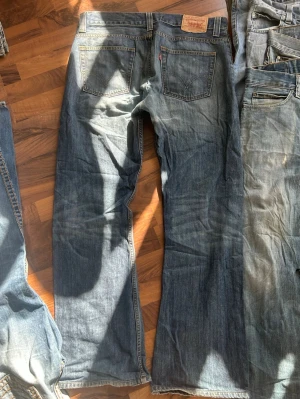 Levi Jeans 512 Bootcut - 36x34, good condition but it has a crotch repair. Reserved 