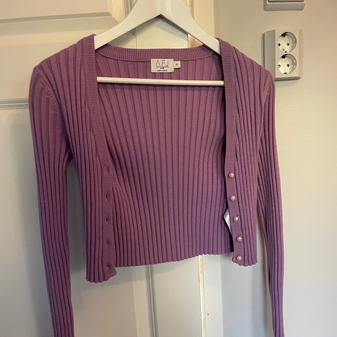 Ribbstickad tröja - 91